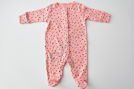 衣服,婴儿期服装粉红色长袖紧身衣为女婴与点打印白色背景白色背景的女婴粉红色紧身衣图片
