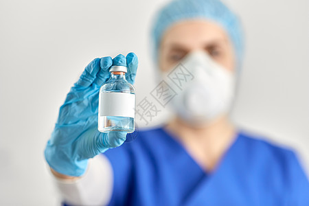 医疗保健大流行医生的手与瓶药或疫苗用瓶药医生的手图片