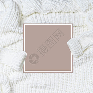 白色针织毛衣,袖子空白卡,顶部视图寒冷天气季节布局平躺为您的Insta风格现代的图片