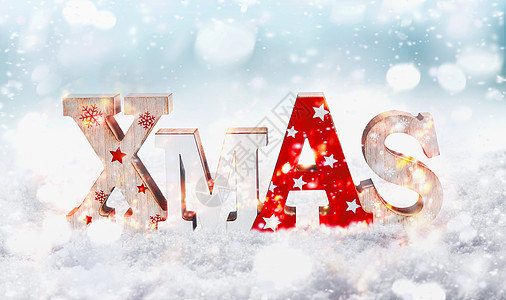 单词圣诞节与Bokeh站雪的冬天背景与降雪圣诞贺卡图片