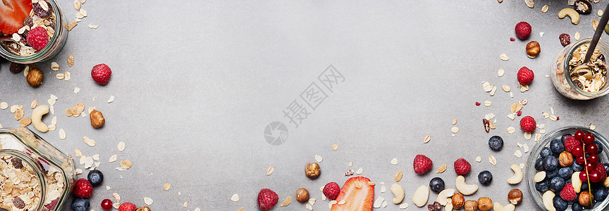 大早餐食品背景与穆斯利,坚果浆果罐子里上面的风景健康健身营养横幅图片
