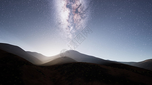 沙漠山脉上方的银河系恒星图片