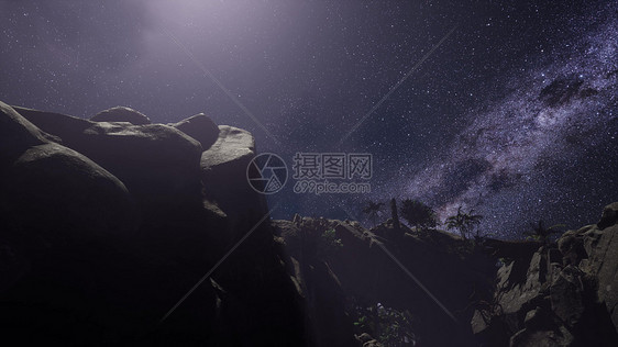 砂岩峡谷墙壁上的4k天体摄影星迹图片