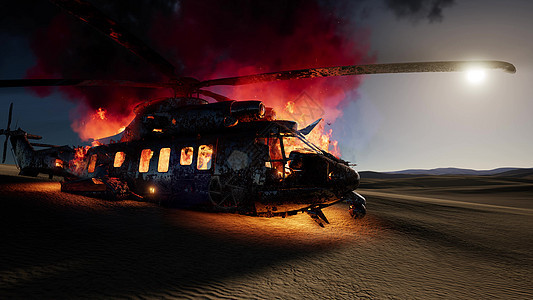日落时沙漠中燃烧用直升机图片