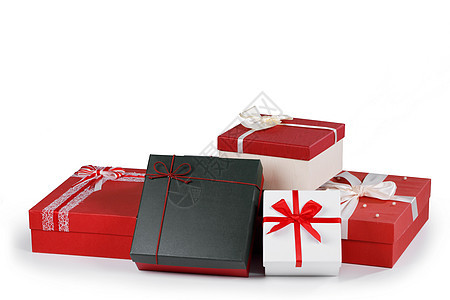 盒子上有用丝带蝴蝶结绑白色背景上的礼物盒子上有白色的礼物图片