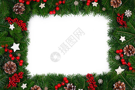 圣诞边框的树枝白色背景与隔离,红白装饰,浆果,星星,锥圣诞树树枝的圣诞框架图片