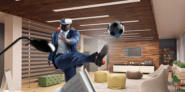 个戴着虚拟现实头盔的房间里的黑人踢足球黑人虚拟现实足球比赛背景图片
