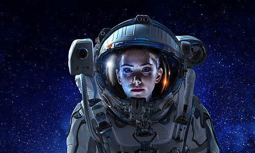 黑暗星空背景下女宇航员的肖像图片