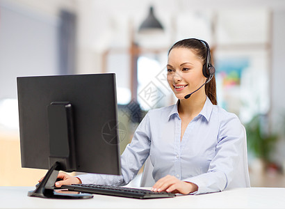 商业,技术通信女帮助热线运营商耳机工作办公室办公室工作的耳机中的帮助热线接线员图片
