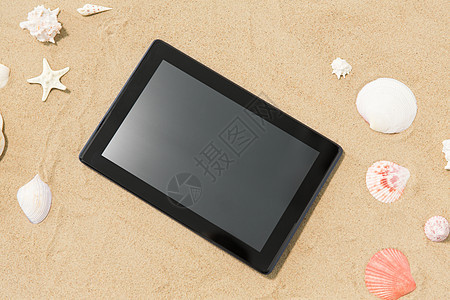 技术,假期暑假平板电脑贝壳海滩沙滩海滩沙滩上的平板电脑贝壳图片