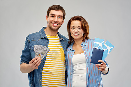 旅行,旅游度假幸福的夫妇机票,护照金钱灰色背景夫妇机票,护照钱图片
