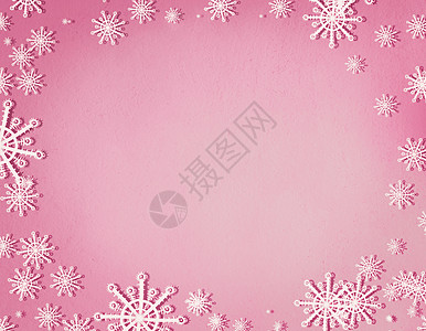 雪花框架粘贴粉红色背景与,顶部视图诞节寒假的图片