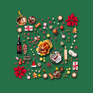 各种诞食品诞晚餐的红色装饰绿色背景上的构图模式,顶部视图图片