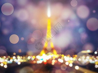 模糊的夜景埃菲尔铁塔的轮廓巴黎闪耀着的波克五颜六色的灯光浪漫的象征背景图片
