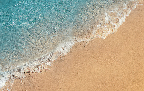 沙滩上碧海的软泡波暑假背景,假期娱乐活动理念图片