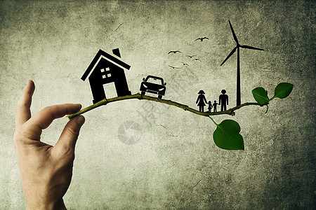 人的手着树枝环境绿色能源幸福的家庭,房子,汽车风车的轮廓图片
