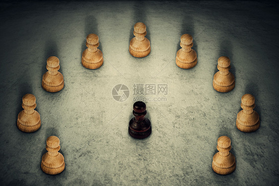 黑色棋子被白色棋子包围,把它们的力量连接商业集领导队工作的象征种族主义欺凌图片