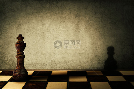 国王棋子混凝土墙上投下棋子的影子复杂管理善的神奇的变图片