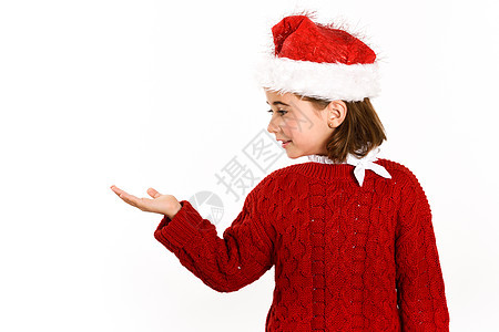 可爱的小女孩戴着诞老人的帽子,隔离白色的背景上诞节的冬天衣服图片