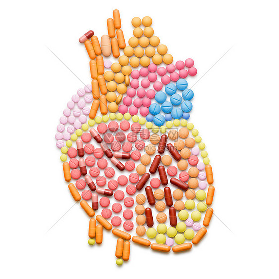 人的心脏形状的药丸,隔离白色上图片
