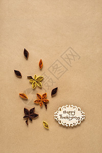 创意感恩节照片的叶子制成的纸张棕色背景图片