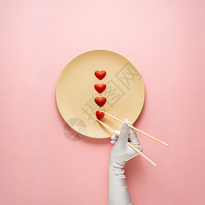 创意照片的厨具与手,画板上的食物粉红色的背景图片