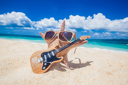 海星吉他手海滩上菲律宾热带海滩沙滩上的海星吉他手图片
