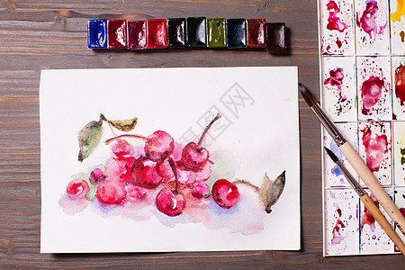 艺术品,水彩画樱桃与绘画工具木制桌子上水彩画樱桃图片