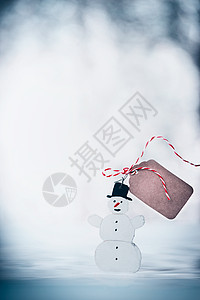 快乐的雪人与黑色帽子,标签模拟丝带雪冬的背景寒假卡图片