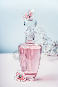 花卉香水瓶与花,正视图香水,化妆品,植物香味柔的颜色美丽的图片