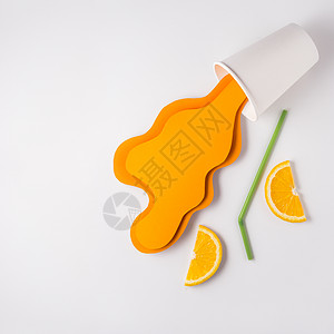 创意照片带走杯子与飞溅橙汁制成的纸灰背景图片