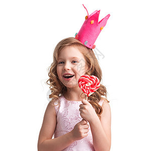 美丽的糖果公主女孩皇冠上着大粉红色心形棒棒糖微笑戴皇冠的女孩着心棒棒糖图片