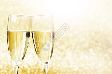 香槟杯抽象闪亮的背景下图片
