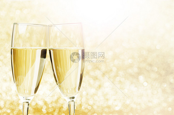 香槟杯抽象闪亮的背景下图片