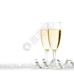 杯香槟银丝带闪闪发光的背景上图片