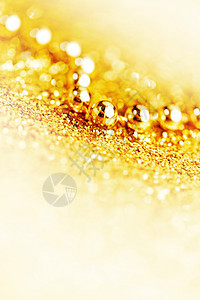 金色诞树花环闪光的背景特写图片