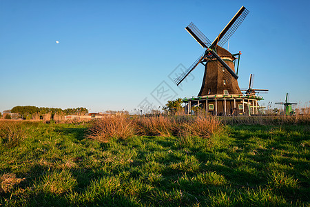 日落时,荷兰著名的旅游景点ZaanseSchans的风车Zaandam,荷兰日落时荷兰的赞斯山的风车赞丹姆,尼瑟图片