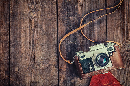 摄影背景旧复古老式相机粗糙的木制纹理老式复古相机粗糙的木制背景图片