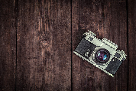 摄影背景旧复古老式相机粗糙的木制纹理老式复古相机粗糙的木制背景图片