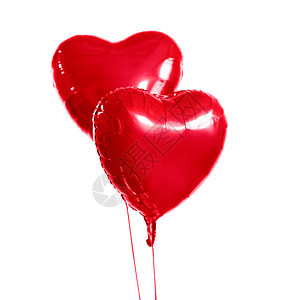 假日,情人节派装饰两个红色氦充气心形气球白色背景上两个红色心形氦气球图片