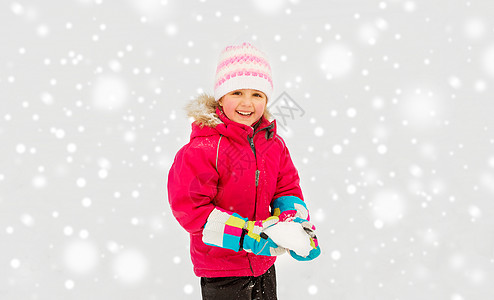 童,休闲季节的快乐的小女孩冬天玩雪快乐的小女孩冬天玩雪图片