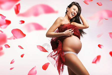 漂亮,精致,孕妇红色花瓣的背景图片