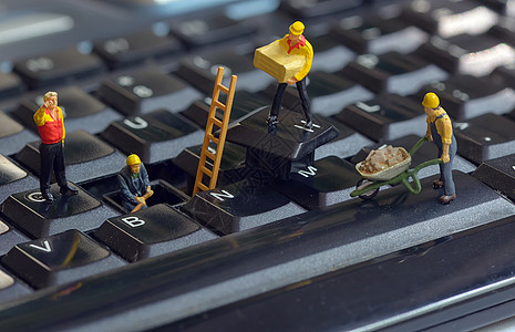 工人雕像修理键盘图片