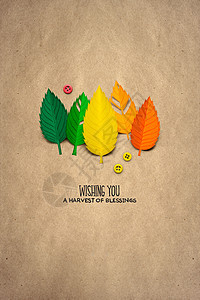 创意感恩节照片的叶子制成的纸张棕色背景背景图片