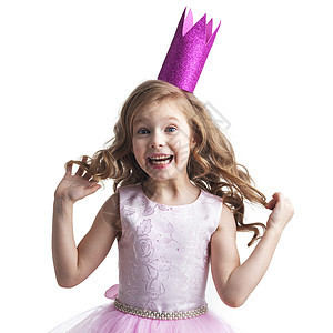 快乐的小公主女孩快乐的小公主女孩穿着粉红色的衣服,皇冠被隔离白色的背景上图片
