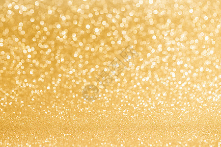 闪亮的金色灯光背景闪亮的金色波克闪光灯抽象背景,诞新派庆祝背景图片