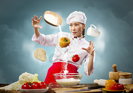 亚洲女烹饪魔术亚洲女烹饪与魔术的颜色背景图片