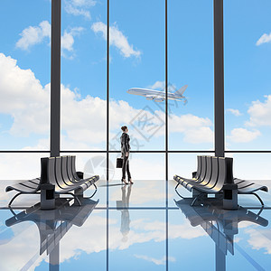 商务旅行机场看飞机飞的女人的形象图片