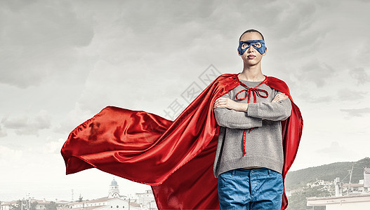 她个超级女人穿着红色斗篷具的轻自信的女人背景图片