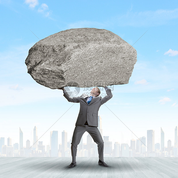 迫眉睫的问题权势的商人头顶着巨大的石头